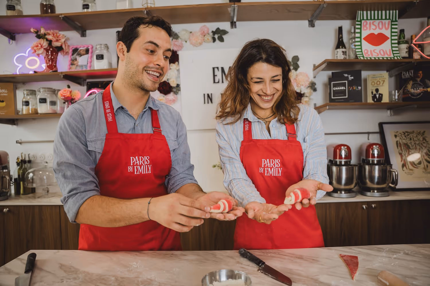 Croissant making two guests holding their raw croissants