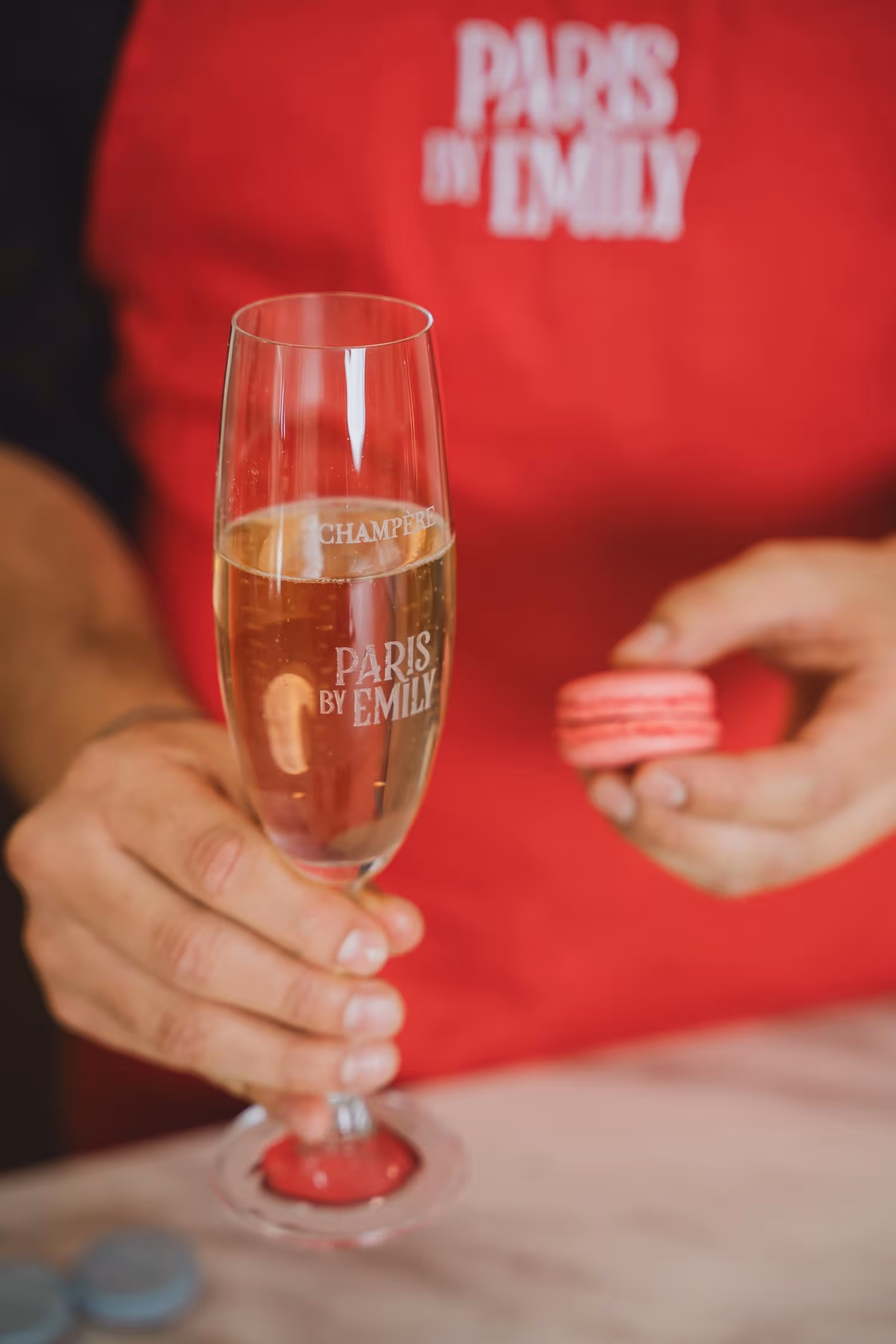 Macaron making class glass of champagne and macaron in the background