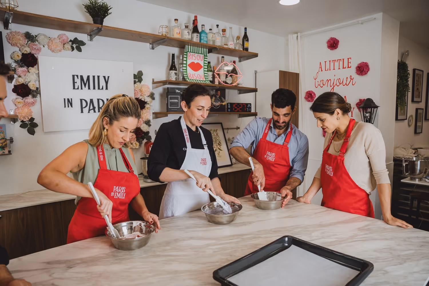 Macaron making group of guests and teacher making the macarons