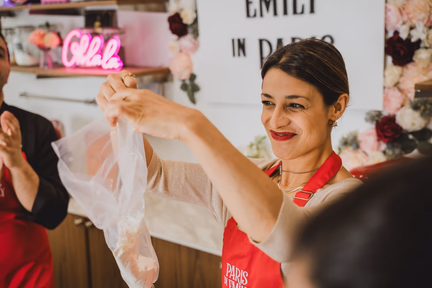 Macaron making guest pouring the mix to pipe the macaron