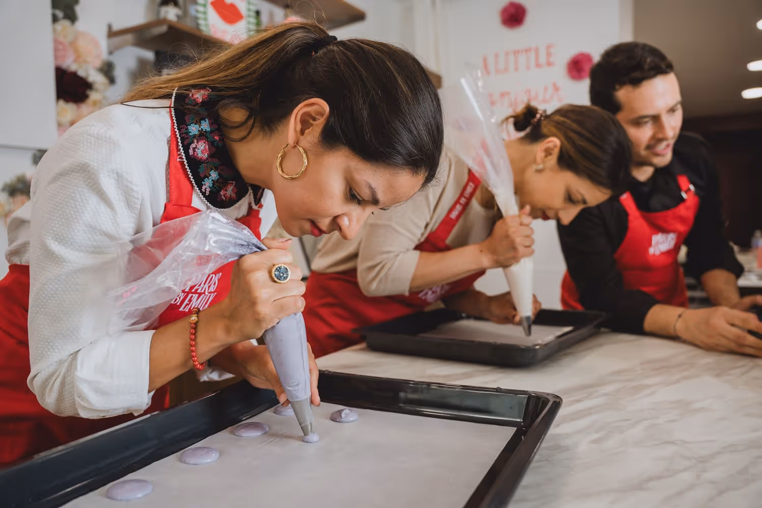 Macaron Making guest piping macaroons