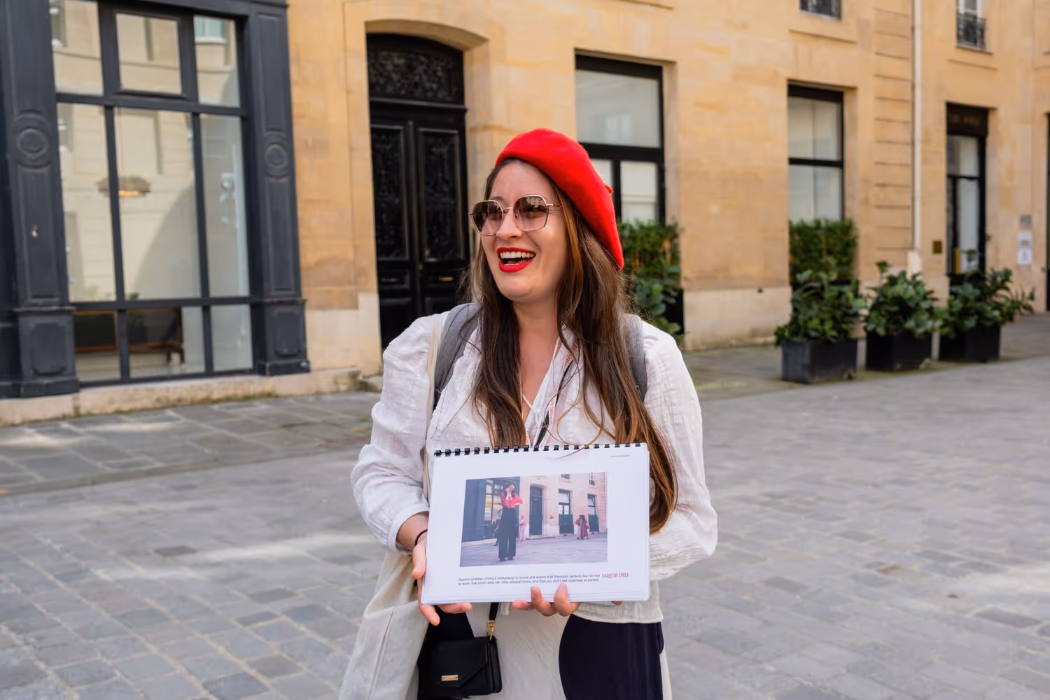 Walking Tour Guide Holding Emily in Paris Image