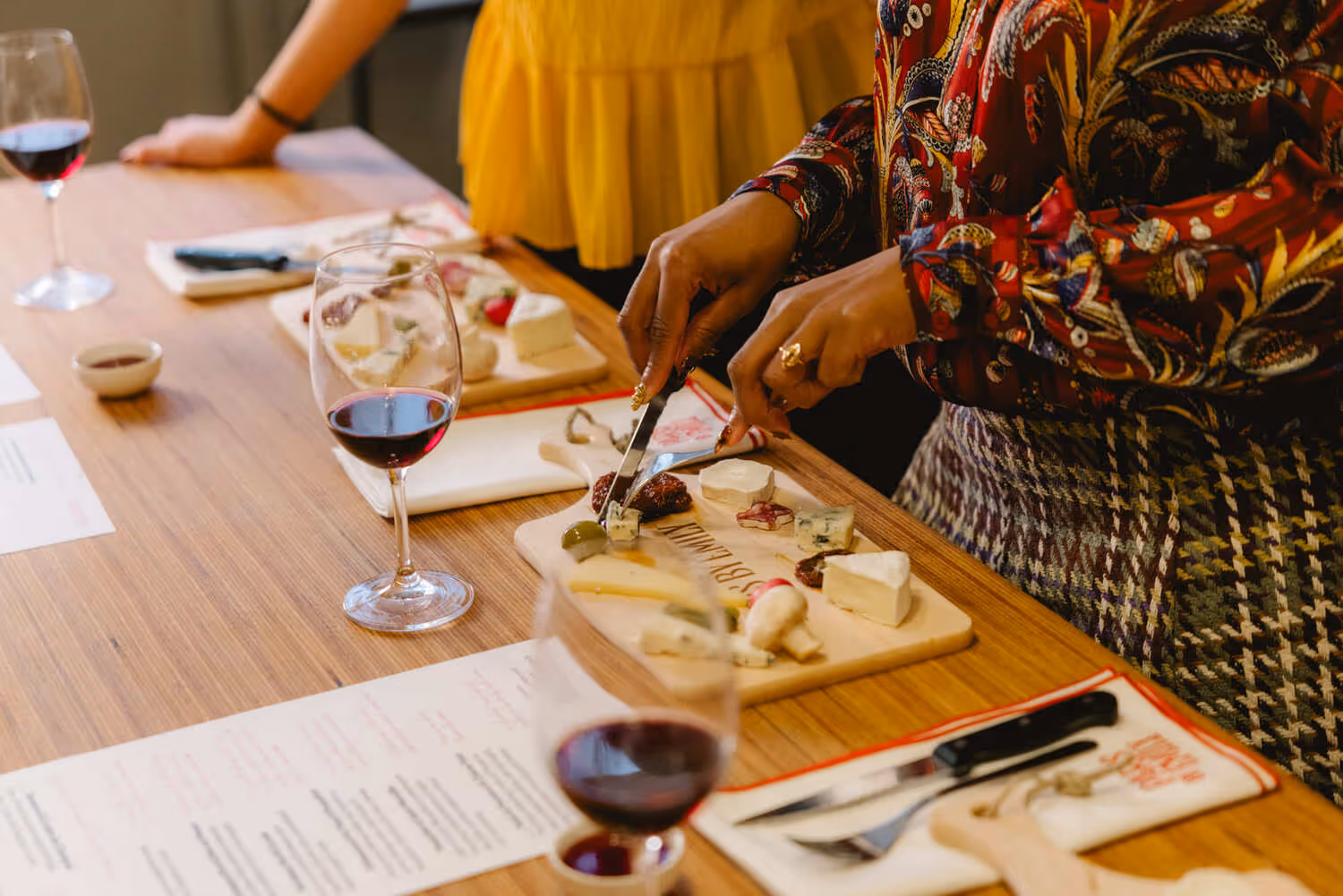 Wine and cheese tasting cutting the cheese